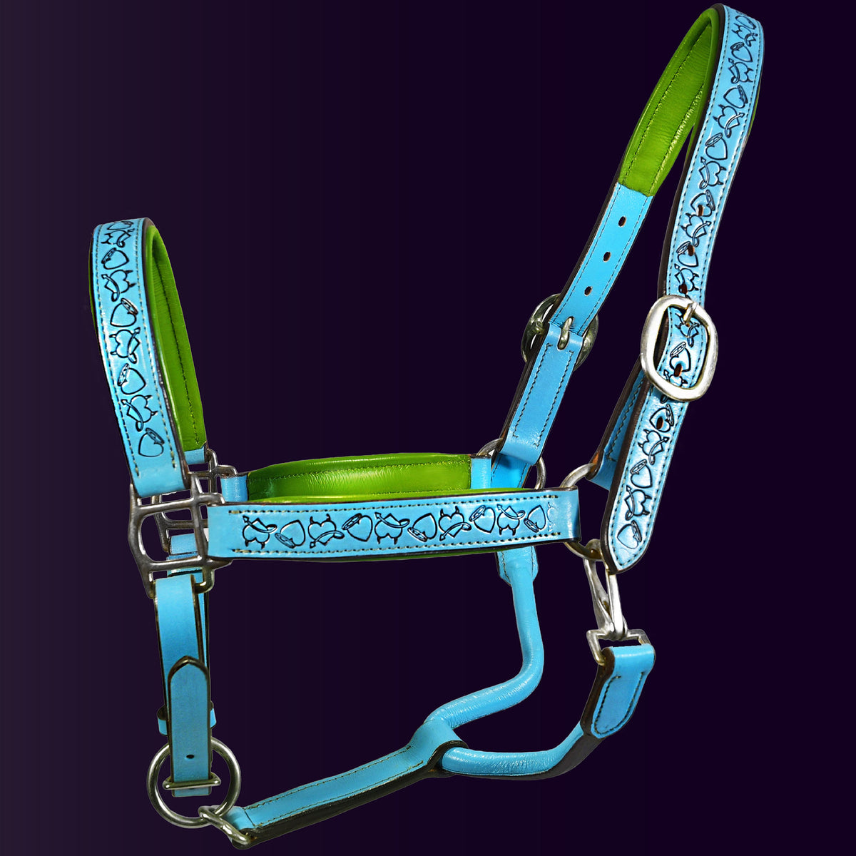 Full front view of the Wiskadero Halo and Horns padded leather halter. Highlights the turquoise blue leather with deeply tooled halo, horn, and heart motifs, vibrant lime green padded leather lining at the crown, noseband, and cheeks, and polished chrome hardware against a dark purple background.