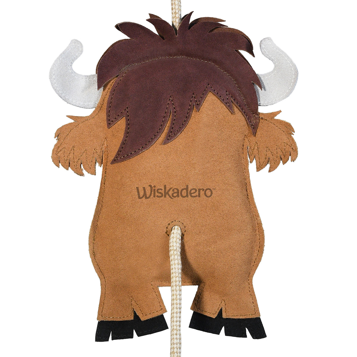 Close-up back view of the Wiskadero Mini High toy showing the brown and tan suede Highland cow body stamped with the Wiskadero logo, shaggy dark brown fringe, white suede horns, black hooves, and pull-through natural rope tail.