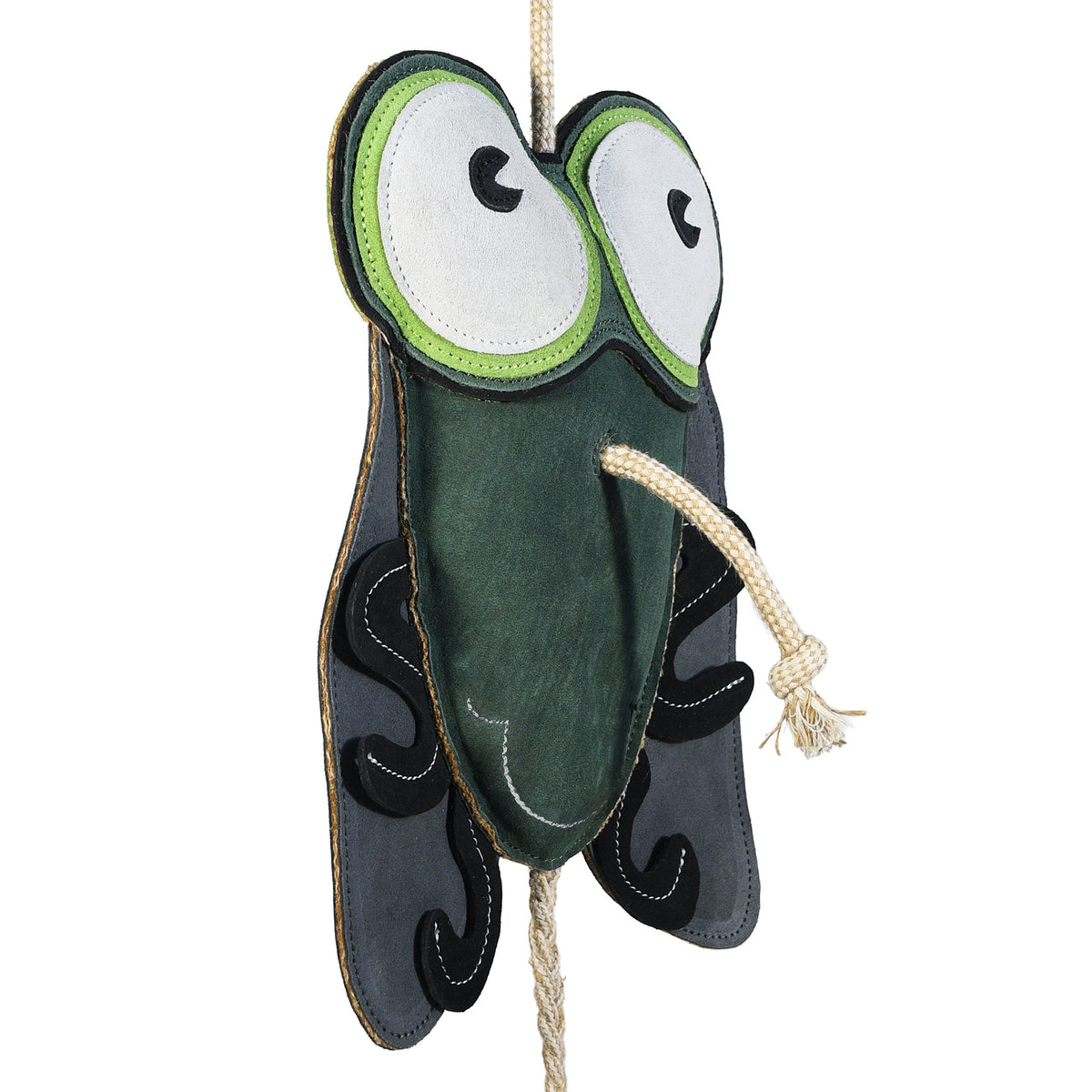Enlarged 3/4 angle side view of the Wiskadero Shoofly equine boredom buster toy. Highlights the dark green suede body, oversized cartoon eyes, dark gray wings with black leg overlays, and the knotted natural rope pull-through nose.