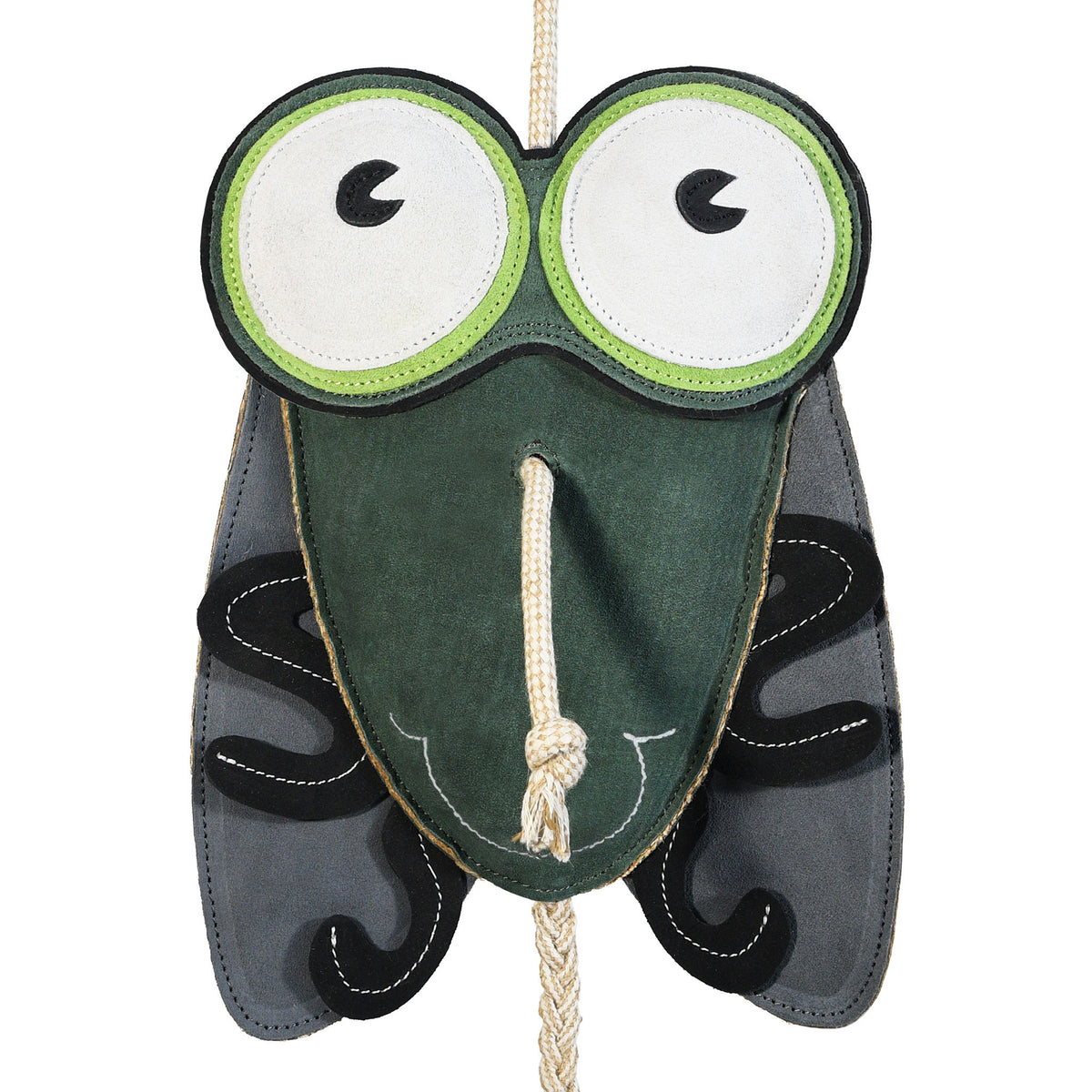 Close-up front view of the Wiskadero Shoofly equine boredom buster toy. Highlights the fly-shaped dark green suede body, oversized green and white cartoon eyes, and a natural rope pull-through nose.