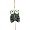 Wiskadero Shoofly equine boredom buster toy in full front view. Features a fly-shaped dark green and black suede body with oversized cartoon eyes in white and green, plus a natural rope hanging loop at the top and rope tail at the bottom.